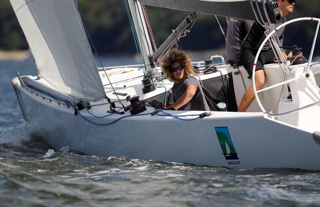 William MacKenzie, trimmer for Team Gilmour and David Gilmour, adjusts the jib while competing in the Oakcliff International on the second day of competition, in Cold Spring Harbor near Oyster Bay, NY on September 6, 2013. © 2013 Molly Riley/Oakcliff